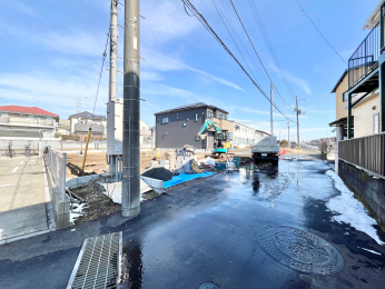 �����s�����q�s������̐V�z��ˌ��Ă̑O�ʓ��H�܂ތ��n�ʐ^